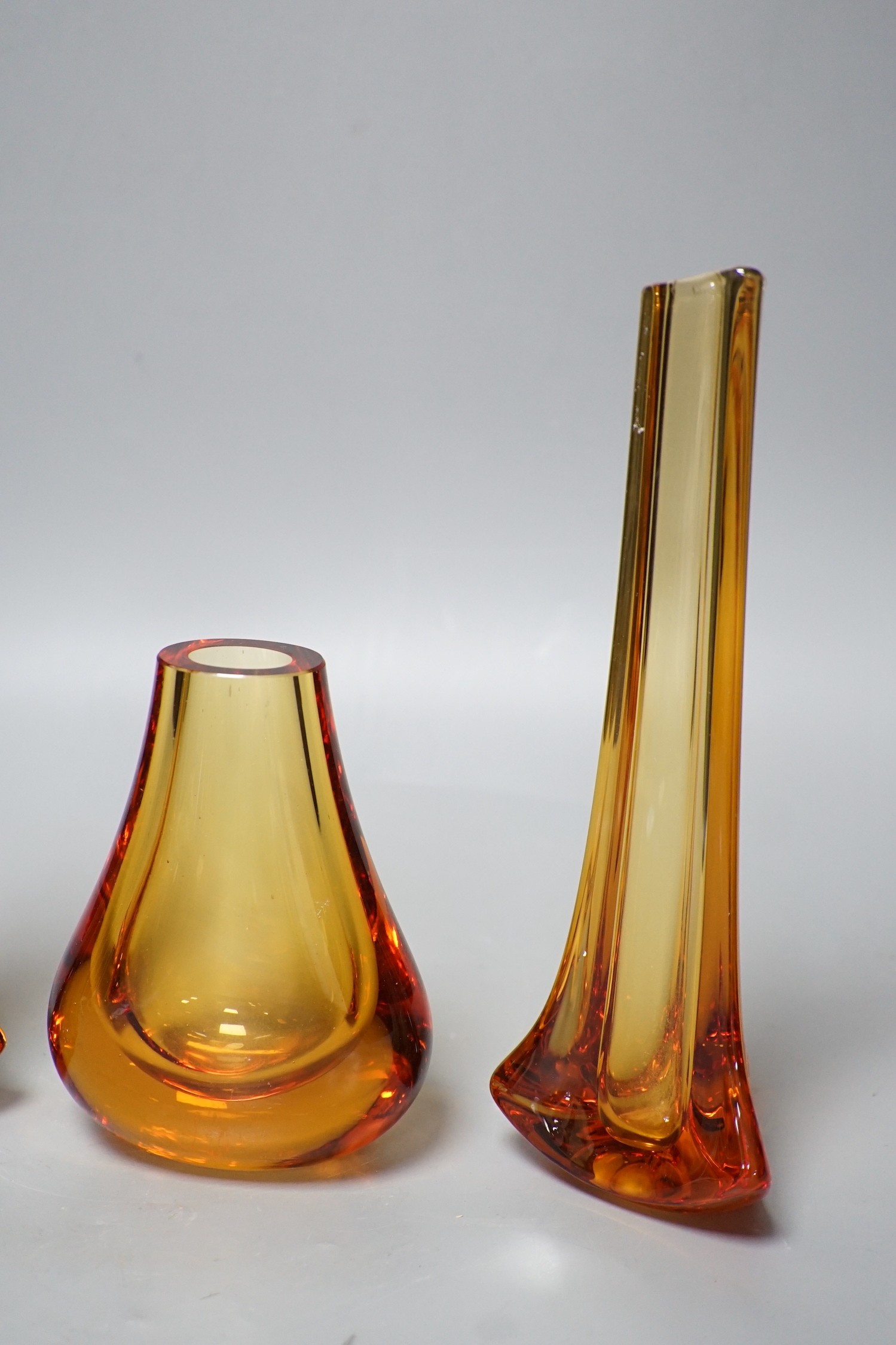 Whitefriars glass - a pair of amber coloured vases and another, 23.5cm